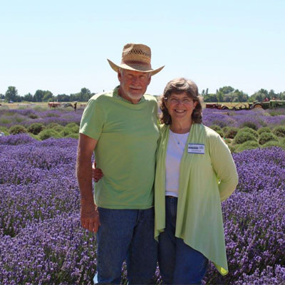 Lavender Acres owners Mike and Donna in field of lavender